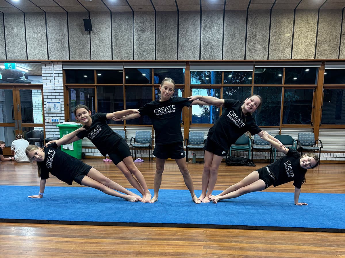 Kids performing acro formation