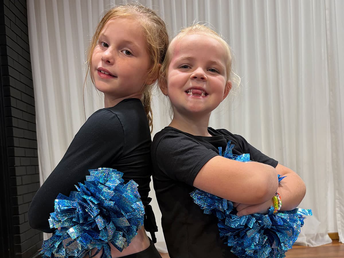 Two dancers with pompoms