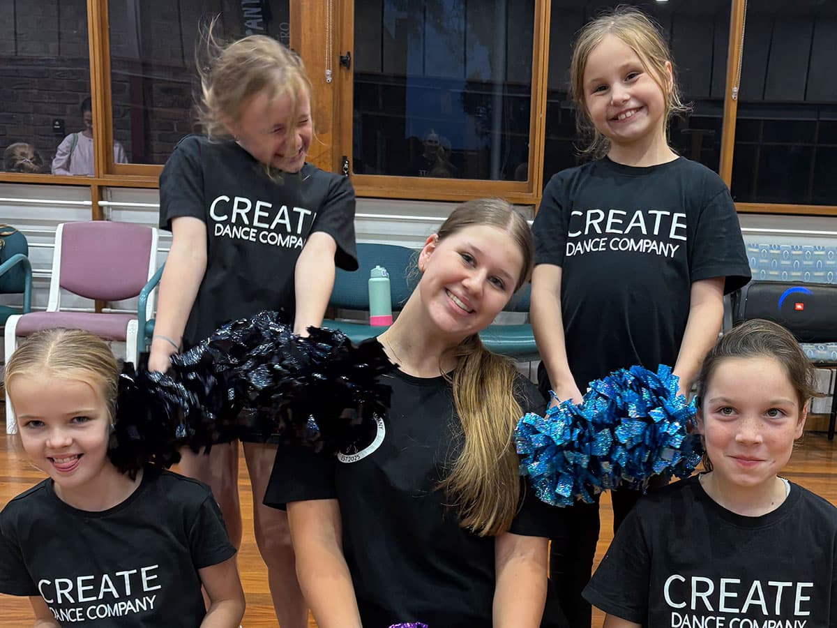 Group of dancers with pompoms